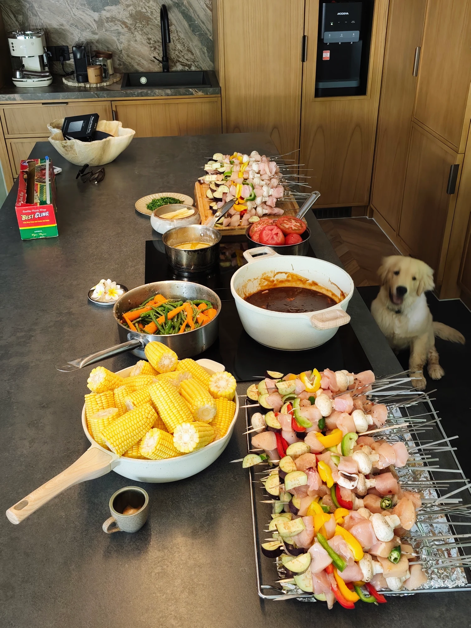 BBQ skewers, corn and vegetables prepared in a villa kitchen