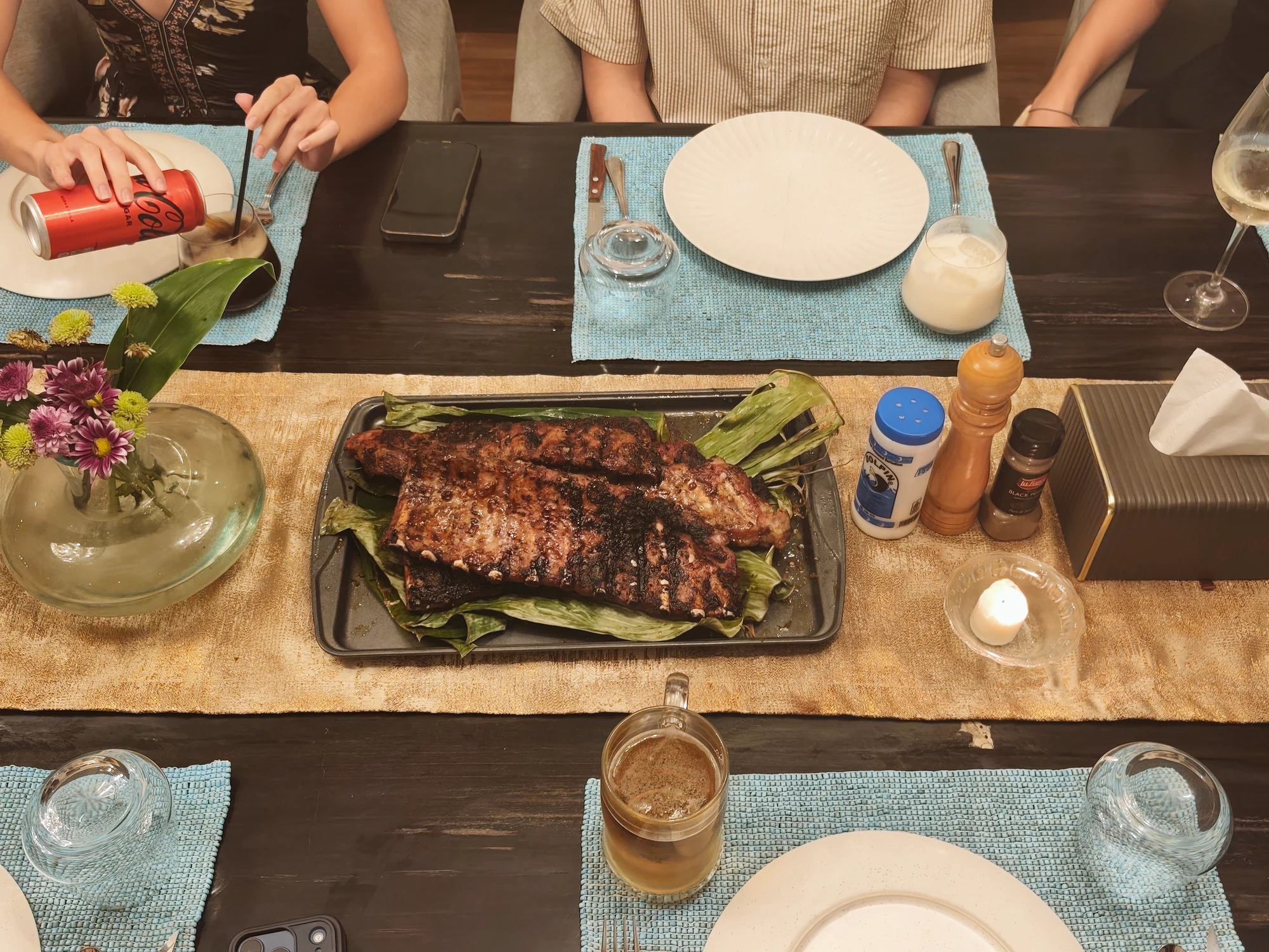 Grilled ribs served at a villa dining table